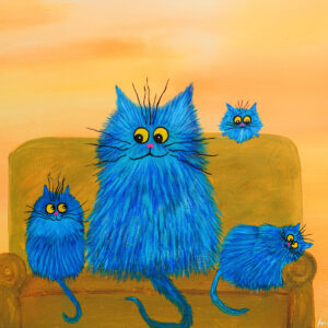 Fluffy Blue Cats Lounging on a Couch